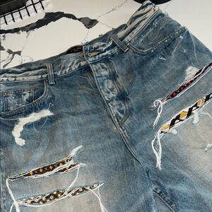 AMIRI Distressed Blue Jeans with Patterned Details
